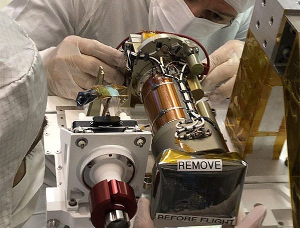 JPL technician Seth Harvey installs the left Mastcam-Z camera head during the June 2019 integration of the Mars 2020 mission’s Perseverance rover’s remote sensing mast (RSM).