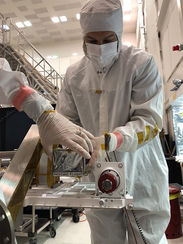 JPL technician Seth Harvey installs the right Mastcam-Z camera head during the June, 2019 integration of the Perseverance rover’s remote sensing mast (RSM).