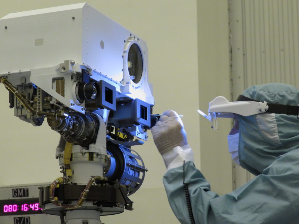 JPL optical technician Jerry Mulder performs a final inspection and swab cleaning of the front optics of the Mars 2020 mission’s Perseverance rover Mastcam-Z cameras at the Kennedy Space Center in March, 2020.
